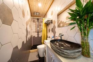 a bathroom with a sink and a toilet at Shanghai Hills&Well-time MCM Family loft Near Line2 and line13 West Nanjing Road in Shanghai +44 photos