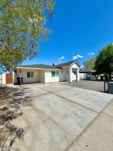 a house with a driveway in front of it at NEW PHX Pool Home With Deep End and Central Location in Phoenix