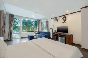 a hotel room with a bed and a television at A25 Hotel - 57 Quang Trung in Hanoi