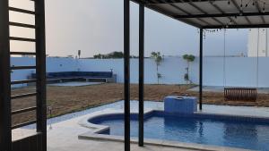 a view of a swimming pool from a building at Gulfa 9 in Sinādil