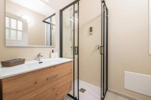a bathroom with a sink and a shower at St John Apartment in Cagliari +14 photos