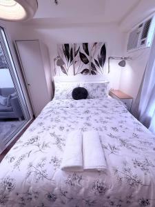 Ένα ή περισσότερα κρεβάτια σε δωμάτιο στο The Camden Place 1BR Condo Apartment +39 φωτογραφίες