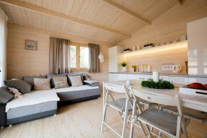 a living room with a couch and a table at Bingo in Ustka