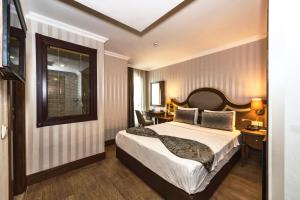 A bed or beds in a room at The Central Hotel