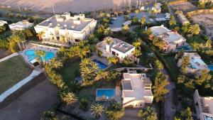an overhead view of a large mansion with palm trees at AG Chalet & Villas Marrakech in Marrakech