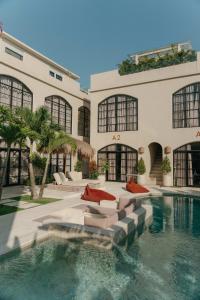 a house with a swimming pool in front of it at Coco Lifestyle Residence in Canggu