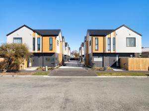 a row of houses on a street at Apartment on Short ! in Christchurch