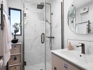 a bathroom with a shower and a sink at Apartment on Short ! in Christchurch +30 photos