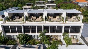 an aerial view of a building with large windows at Villa Ceylon 4 Uluwatu in Uluwatu