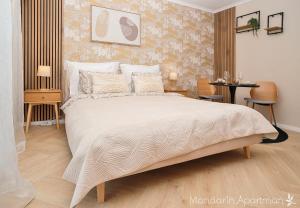 Ένα ή περισσότερα κρεβάτια σε δωμάτιο στο Mandarin Apartment