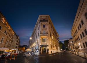 a building on a city street at night at HT6 Hotel Roma in Rome