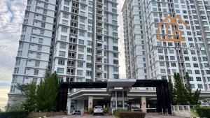 a large white building with a parking lot in front of it at ImpianKU at Shaftsbury Suite Cyberjaya - Studio in Cyberjaya