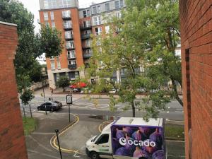 a van parked on a street in a city at Newly amazing refurbished two bedroom apartment in Harrow on the Hill