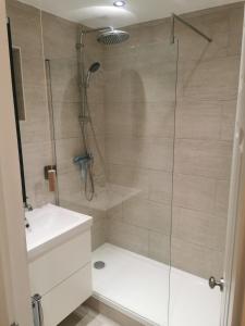 a bathroom with a shower and a sink at Newly amazing refurbished two bedroom apartment in Harrow on the Hill +19 photos
