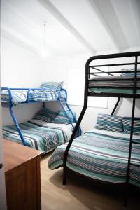 a room with two bunk beds in a room at Seabliss in Lancelin