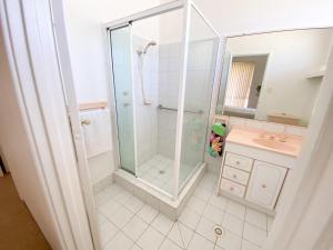 a bathroom with a shower and a sink at White Sands in Lancelin +30 photos