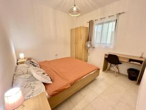 Postel nebo postele na pokoji v ubytování Be Happy Three-Bedroom Apartment