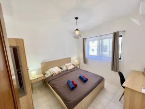 Postel nebo postele na pokoji v ubytování Be Happy Three-Bedroom Apartment + 6 fotografií