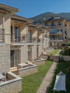 a view of a building with a yard at Anemolia Resort and Spa in Ioannina