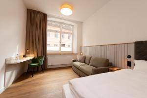 Ένα ή περισσότερα κρεβάτια σε δωμάτιο στο Hanse House Wismar