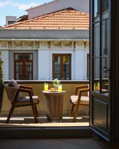 a view of a balcony with a table and chairs at The Wings Hotels Pera in Istanbul