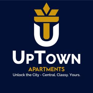a sign that reads uptown apartments under the city central catteryasonyrs at UpTown Apartments in Iaşi