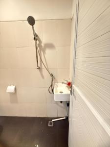 a bathroom with a shower and a sink at Home Stay Room in Bali Near Sanur Beach in Sanur +12 photos