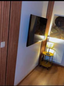 a room with a table and a picture on the wall at Coumbis Faye in Brussels