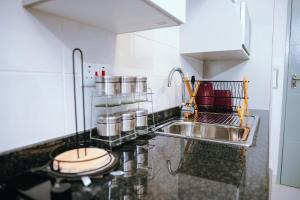 a kitchen with a sink and a counter top at Lanekwa's in Gaborone