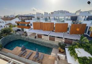 an aerial view of a building with a swimming pool at Villa Atenea Grupo AC Gestion in Zahara de los Atunes