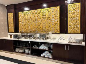 a kitchen with aasteryasteryasteryasteryasteryasteryasteryasteryasteryasteryasteryastery at THE TRIUMPH Hotel in Varanasi