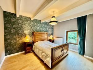 Postel nebo postele na pokoji v ubytování La Ferme du Pré Toussaint - Spacieux gîte au calme