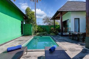 a swimming pool in the backyard of a house at WK Penida Cottage in Nusa Penida +31 photos
