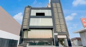 a tall black building with stairs in front of it at Comfort Stay - Near Airport in Lucknow