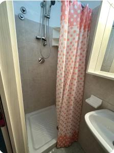 a bathroom with a shower with a shower curtain at Casa privata in collina in Gemmano +8 photos