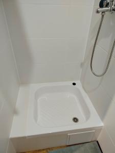 a white sink in a bathroom with a shower at Chata z Pary in Prącki +30 photos