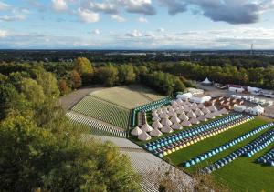 an aerial view of a garden with umbrellas at Festanation Oktoberfest Camp #2 in Munich
