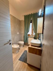 a bathroom with a sink and a toilet at Twin Homes - Tamerò Estates in Poggio Mirteto +26 photos