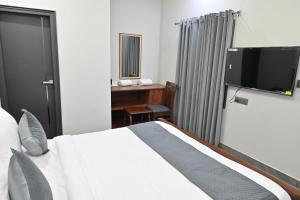 TV a/nebo společenská místnost v ubytování Hotel Devaan