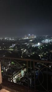 a view of a city at night with lights at Kaveri Stay in Greater Noida