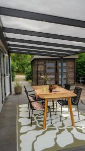 Patio nebo venkovní prostory v ubytování Boshuisje met kachel "Huisje van Loof" op de Veluwe