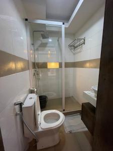 a bathroom with a toilet and a shower at Presken Hotel Reliance, Allen, Ikeja, Lagos in Ikeja +29 photos