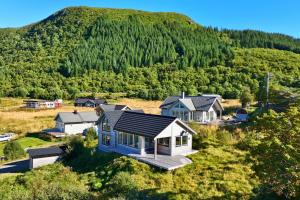 an aerial view of a house on a hill at Cozy Cabin Haukland Beach Area in Leknes