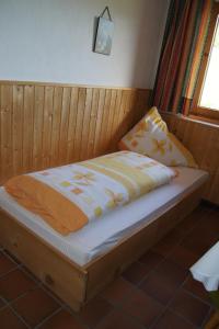 a bed sitting in a room with at Riedhof in Mieders