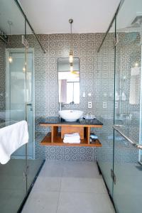 a bathroom with a sink and a mirror at Seavista Apartment Da Nang in Da Nang +30 photos