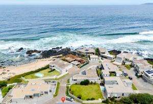 an aerial view of a beach with houses and the ocean at Keursands Luxury Beachside Holiday Escape in Keurboomstrand
