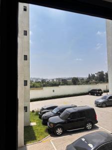 a group of cars parked in a parking lot at Stay with queen in Marimbeti