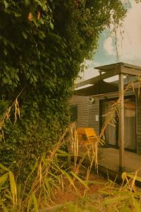 a wooden deck with a table in front of a house at L'ATELIER de RUELLE in Ruelle-sur-Touvre
