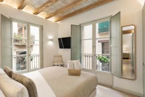 Μια τηλεόραση ή/και κέντρο ψυχαγωγίας στο Ola Living Portaferrissa +217 φωτογραφίες
