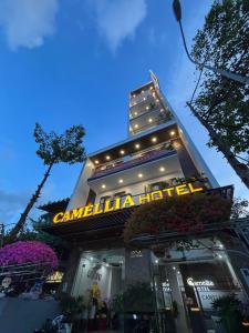 a building with a sign on the front of it at Camellia Hotel Can Tho in Can Tho